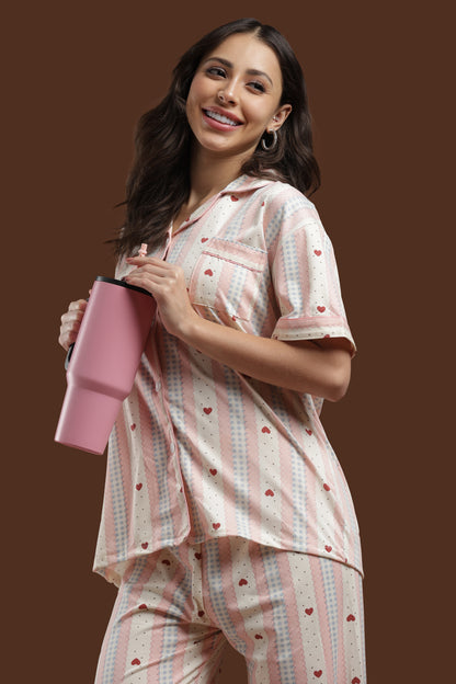 Close-up of the Koozy heart print fabric, highlighting the soft, breathable cotton material and high-quality pink and white striped print. A must-have nightwear suite for sensitive skin.