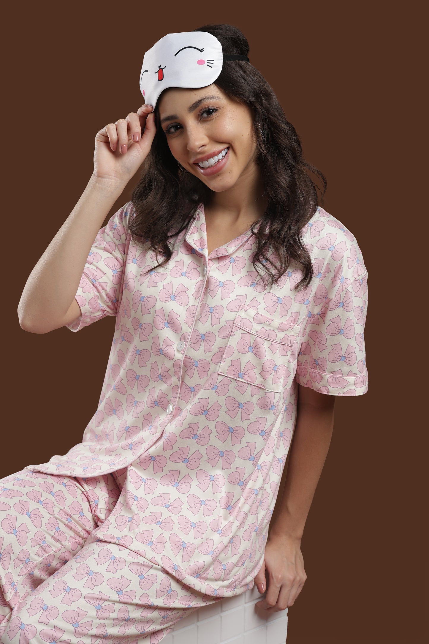 back view of the koozy short-sleeve nightwear suite, demonstrating the roomy fit and continuous pink ribbon print. a perfect example of a cozy, elegant loungewear aesthetic.