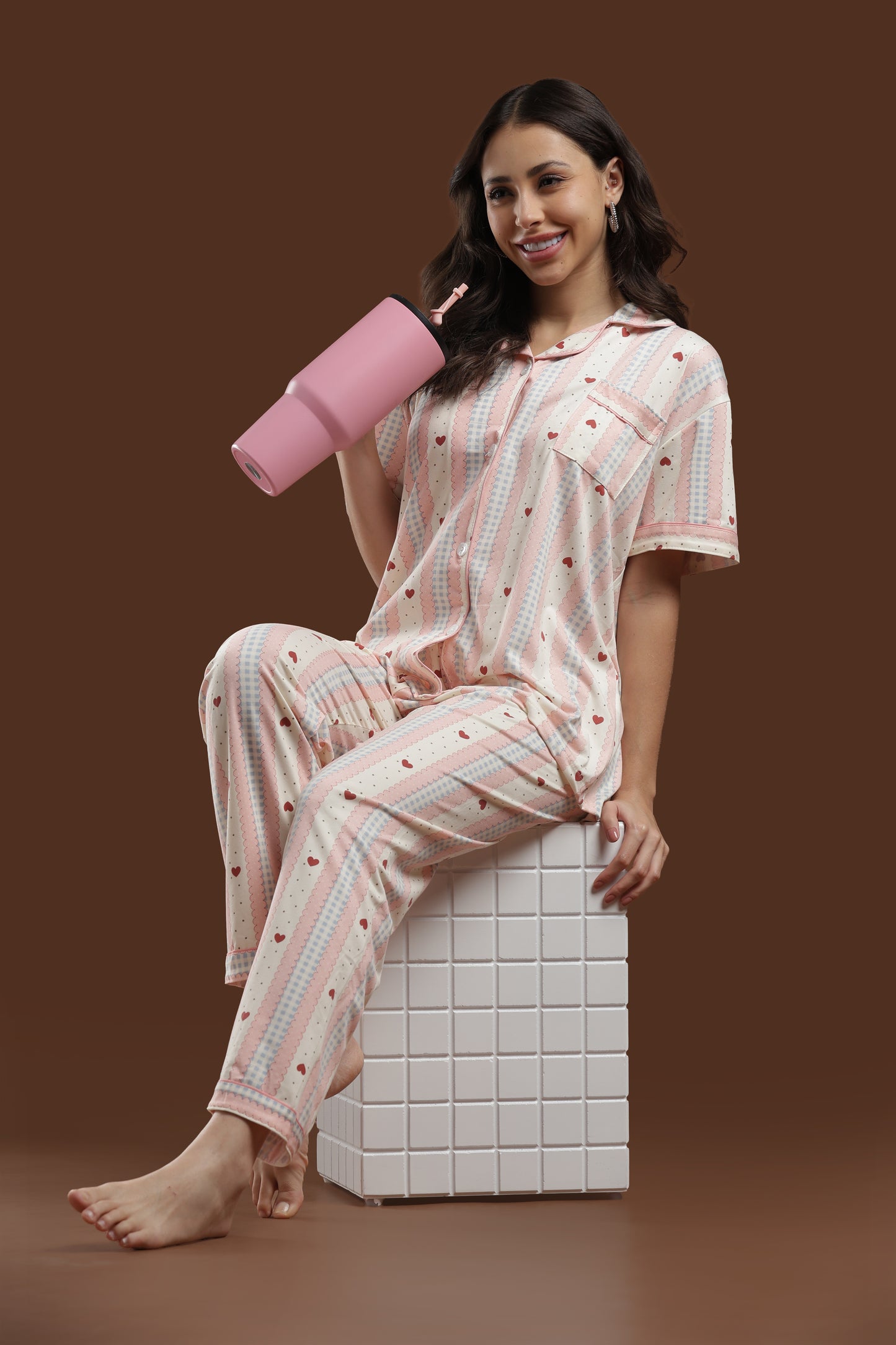 side view of the koozy pink heart print pajama set, showing the relaxed fit and comfortable drape of the breathable cotton fabric. perfect for an easy, cozy lounging aesthetic.