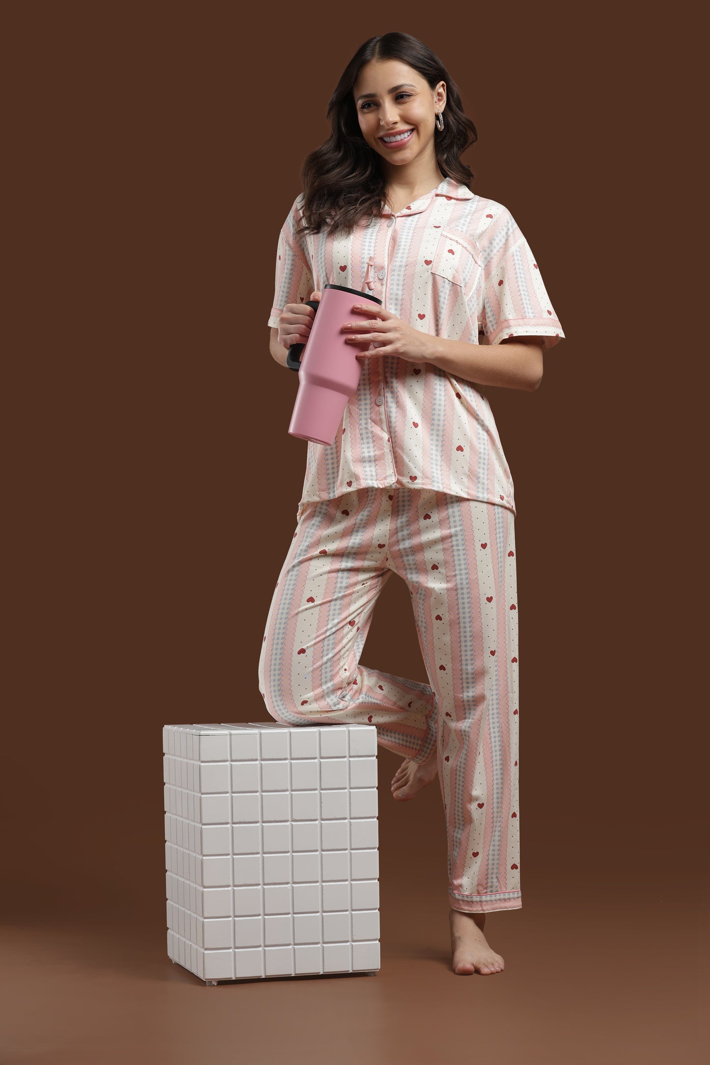 effortlessly cute and comfortable koozy pajama set in a pink heart print. a pinterest-style cotton, breathable fabric nightwear suite designed for a soft, easy, and cozy look. relaxed fit, light-colored, and beautifully printed pj set for women.